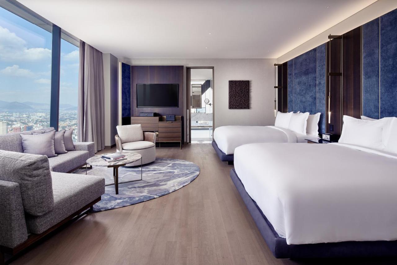 Deluxe Corner Queen Room with Two Queen Beds and City View
