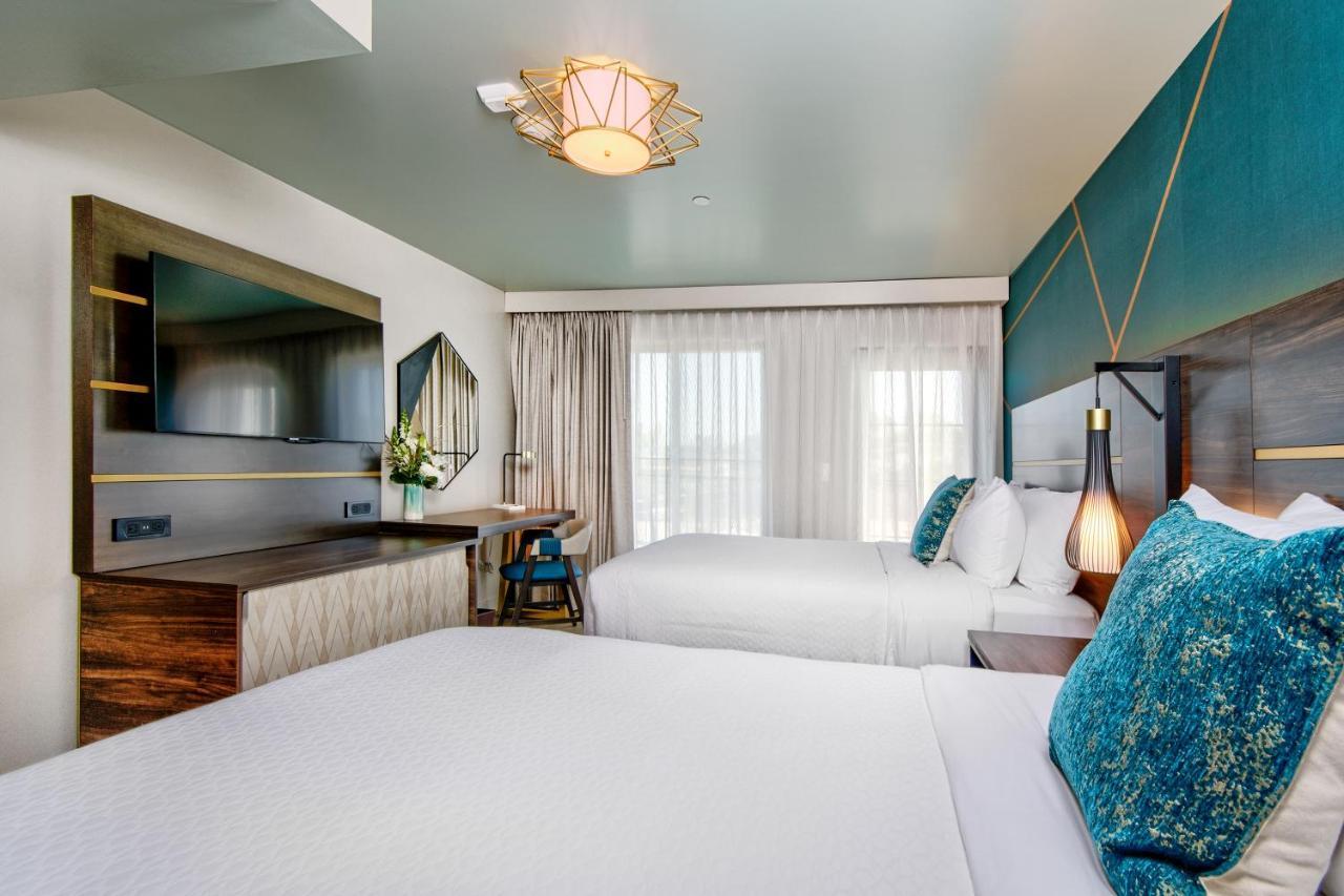 2 Double Beds with Balcony and Partial Ocean View