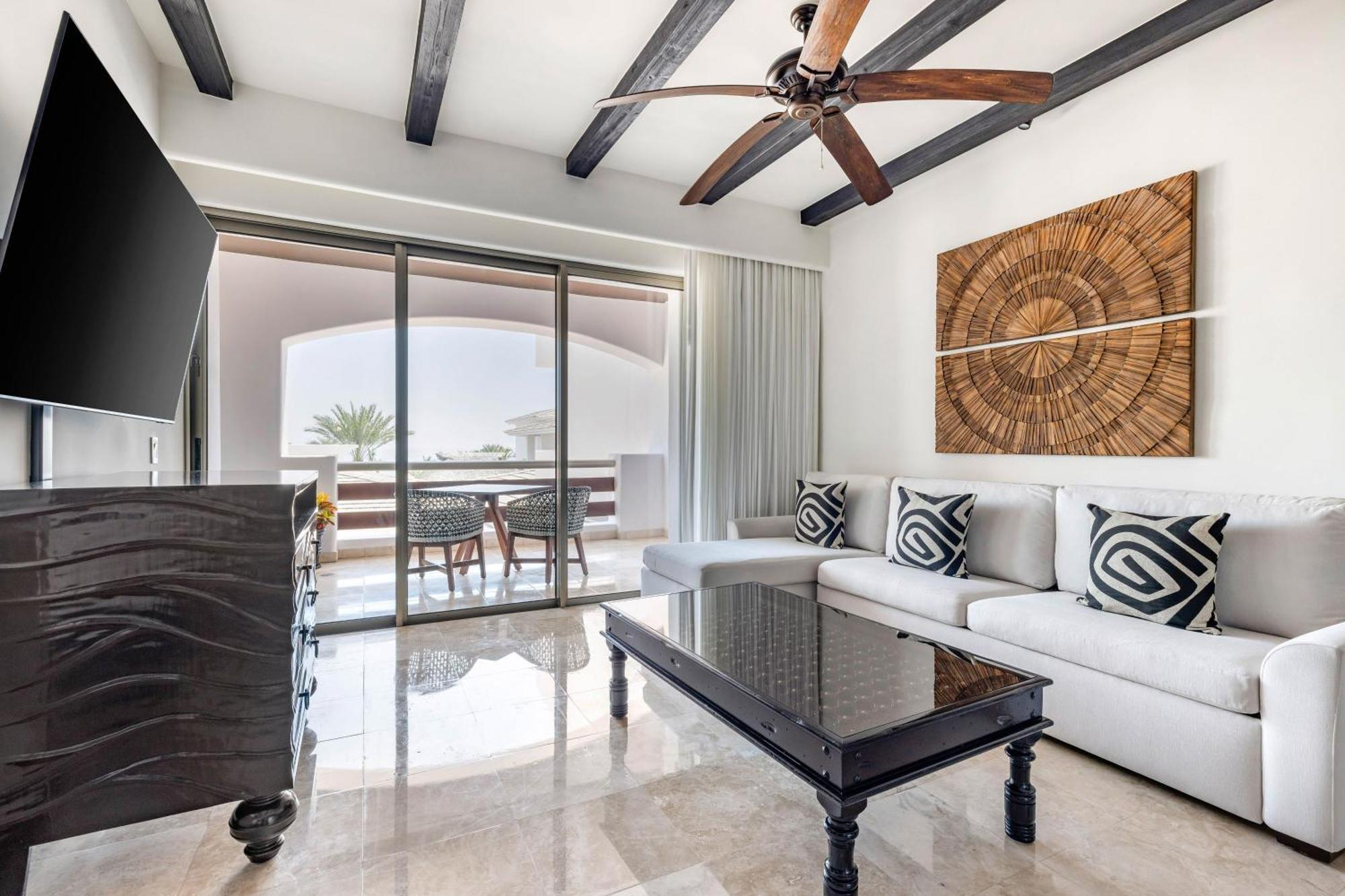 One Bedroom King Room with Partial Pool View and Balcony